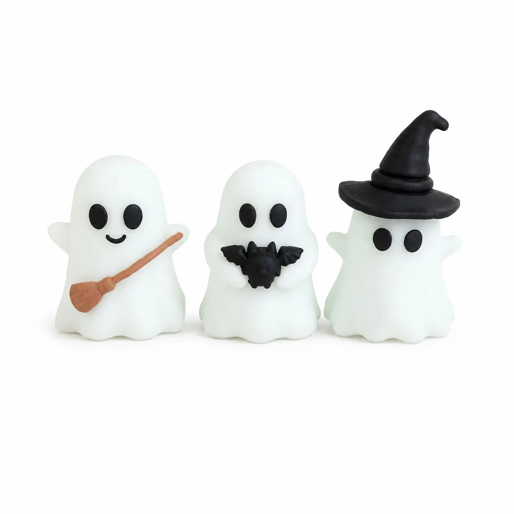 Halloween-themed desktop decoration scene - cute little ghosts, decorative items, mini glowing micro-landscape