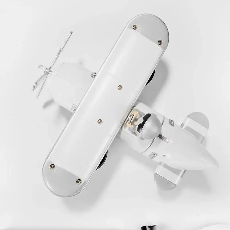 White vintage-style biplane model airplane flip desk clock with metallic accents and a propeller designed as vintage table decor.