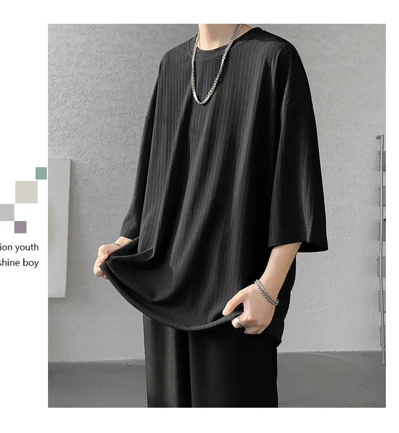Black ribbed cotton men striped oversized summer t-shirt with three-quarter sleeves and a relaxed fit.