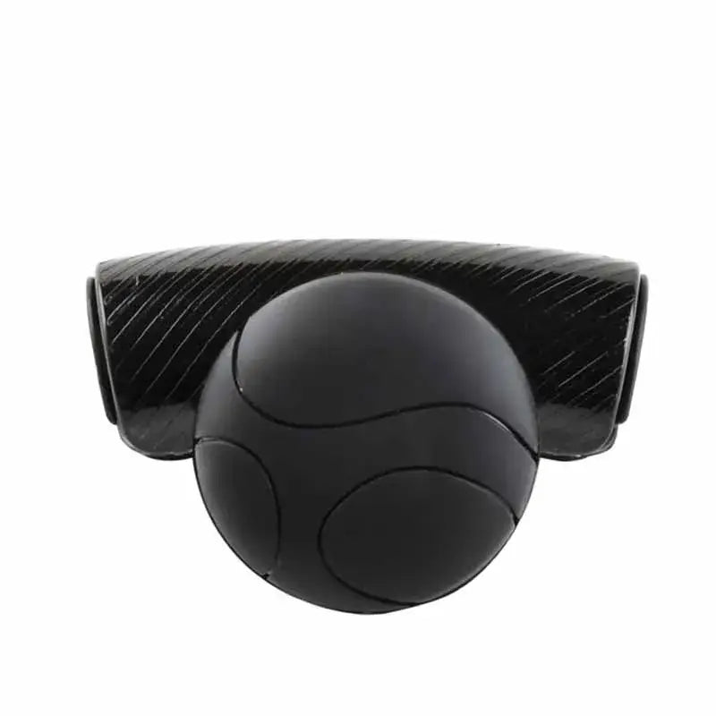 Black carbon fiber steering wheel spinner knob with a spherical segmented center piece designed for 360 degree turn assist.