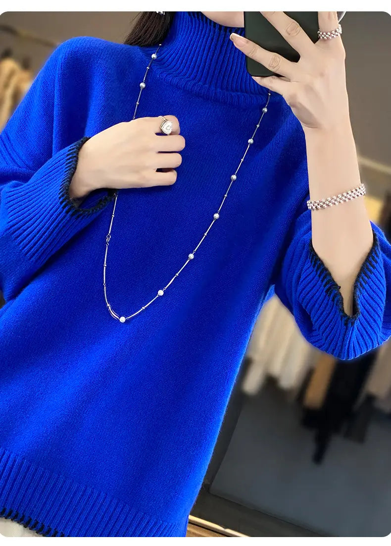 Vibrant royal blue pure wool turtleneck sweater for women featuring a high neck with ribbed cuffs and hem.