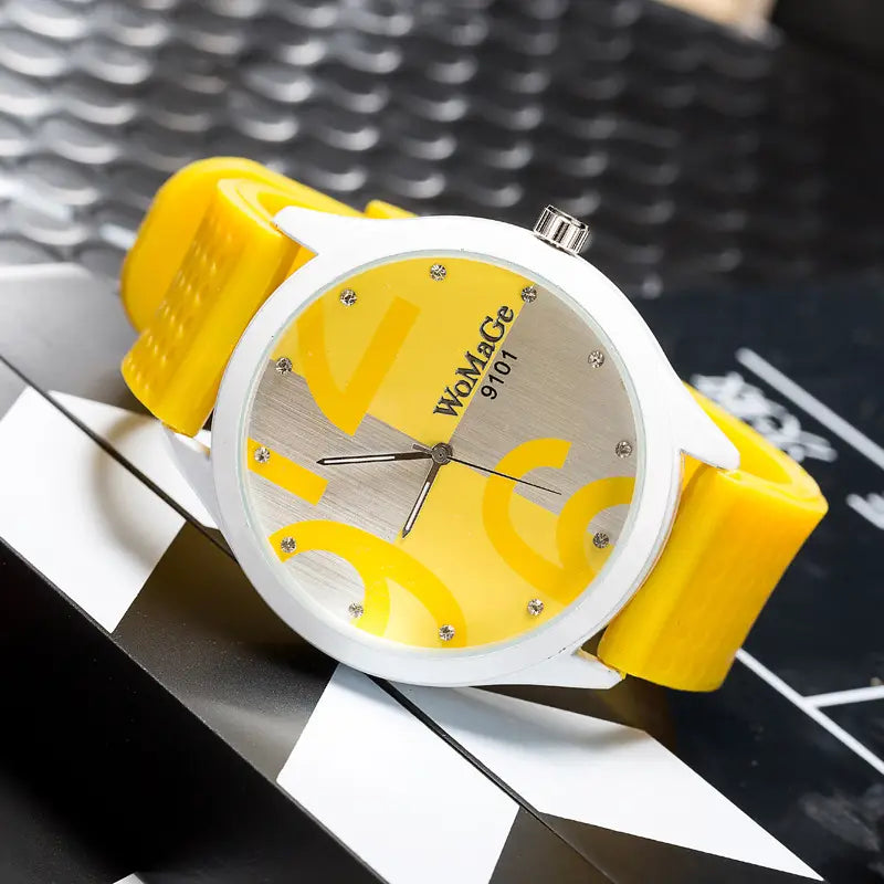 Womage Green silicone quartz fashion watch with a yellow silicone strap white case and a yellow and silver dial featuring womace 9101 branding.