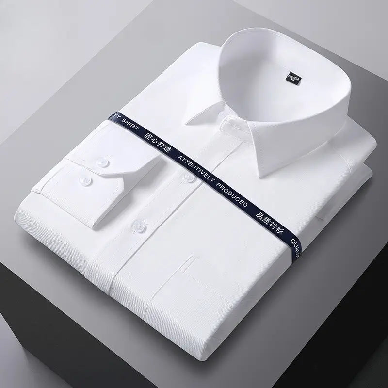 A crisp white men long sleeve dress shirt with a classic collar and buttoned cuffs neatly folded and wrapped in a black ribbon band designed for formal office wear with anti wrinkle fabric.