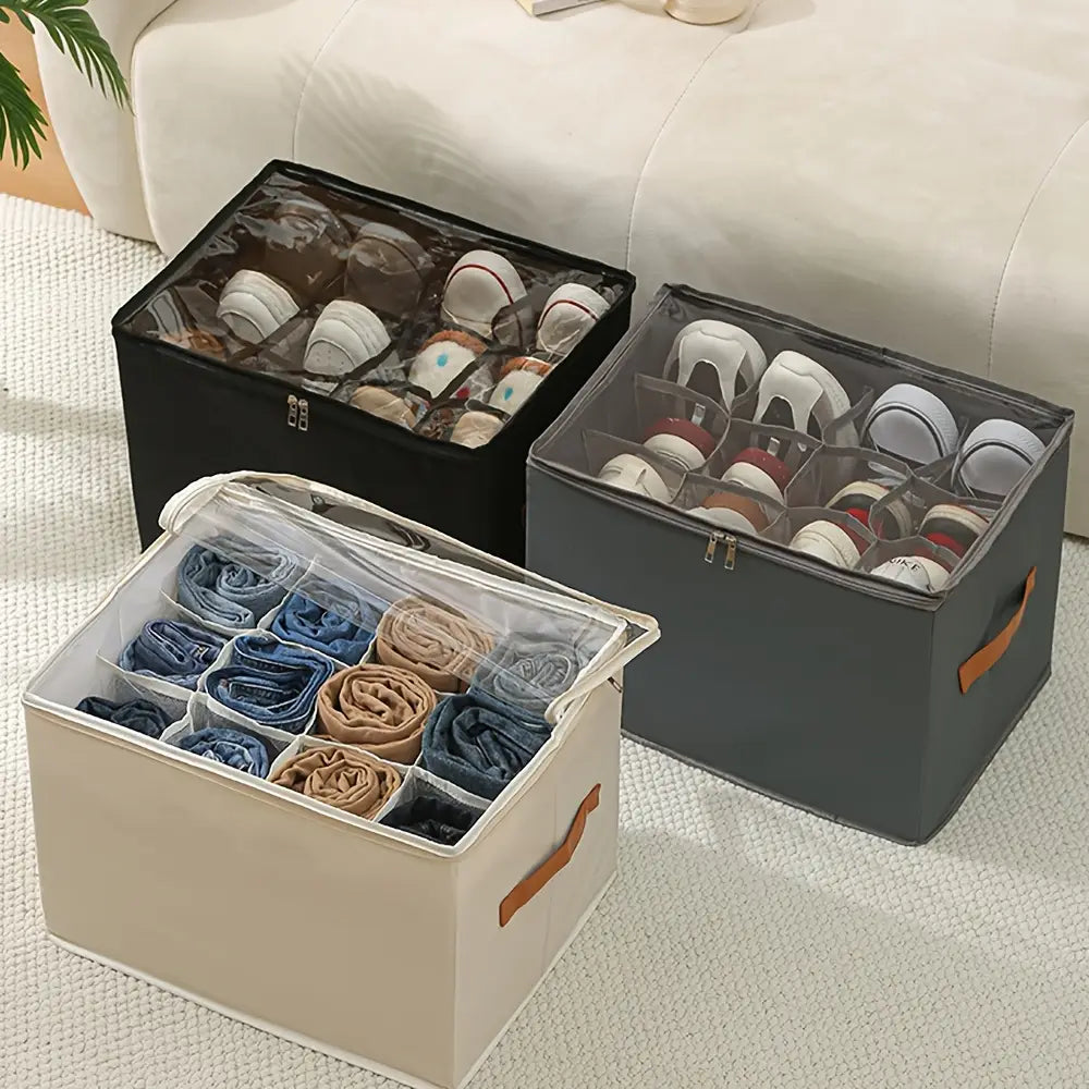 Boîte d’organisateur de rangement pour chaussures en tissu d’oxford beige pliable, avec panneau avant transparent et poignées orange, divisée en compartiments pour organiser des jeans roulés.