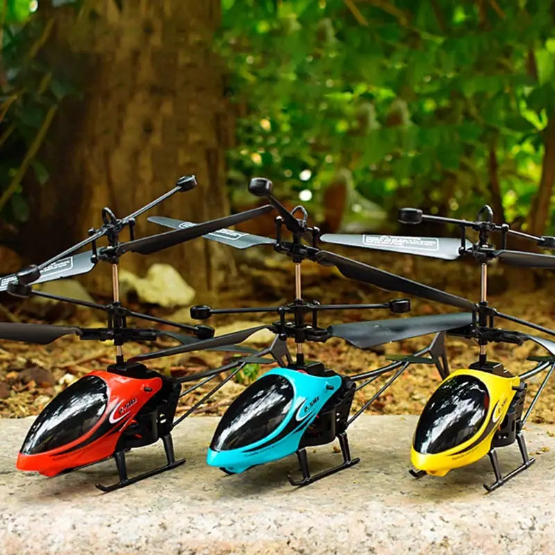 Three remote control helicopters in red blue and yellow with black accents and transparent canopies featuring led lights included in the package for remote control aircraft enthusiasts.