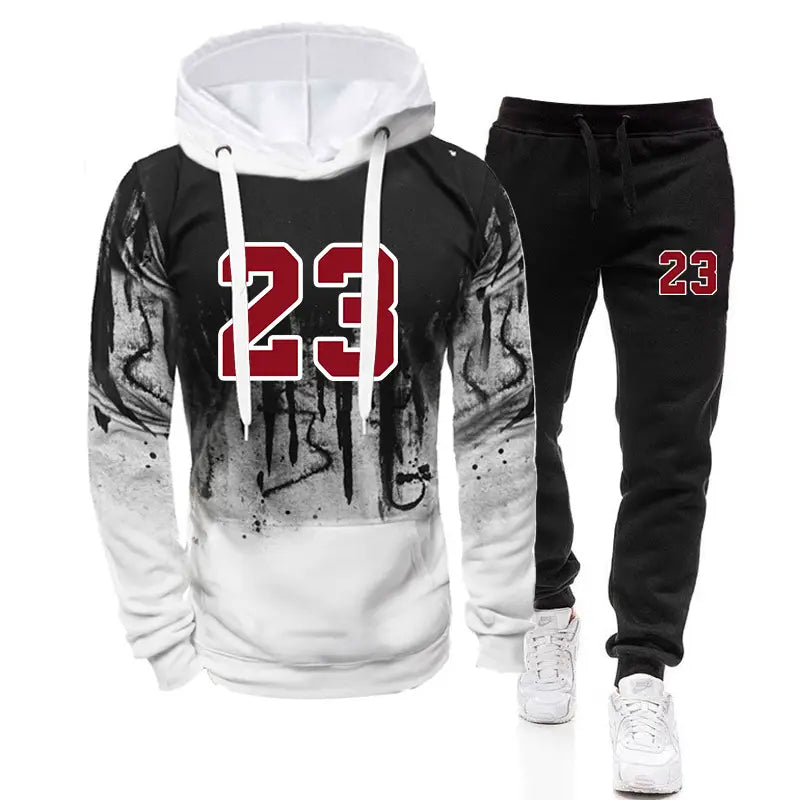 Ensemble sweat à capuche et jogging pour homme portant le numéro 23, en noir et blanc, avec un graphique rouge 23 sur tissu en mélange de coton, pour un port décontracté.