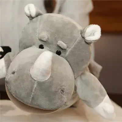 A soft gray plush rhinoceros toy with white accents on its nose ears and feet as part of educational baby toys in a lion elephant bunny hand finger puppet set.