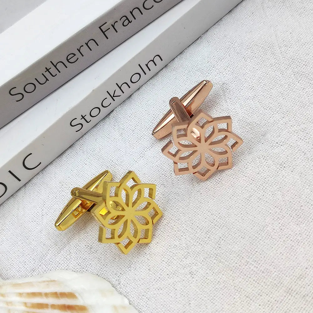 A pair of stainless steel floral cufflinks for men featuring elegant rose gold and yellow gold geometric flower designs.
