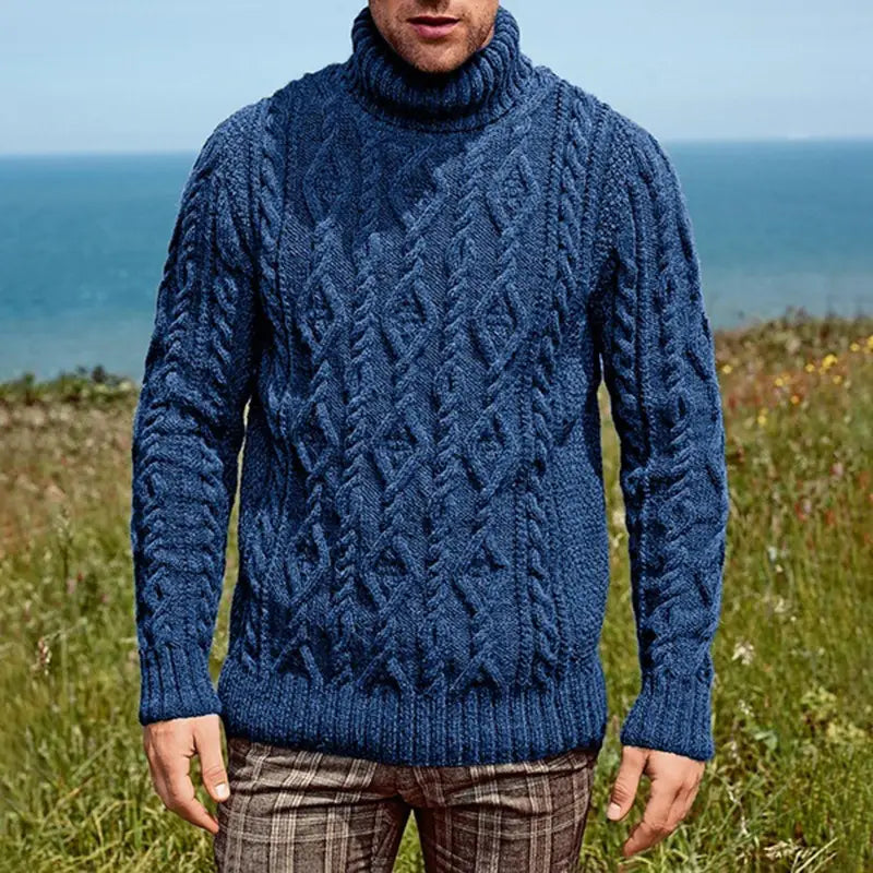 Men turtleneck cable knit sweater in deep blue featuring intricate braided patterns and ribbed cuffs.