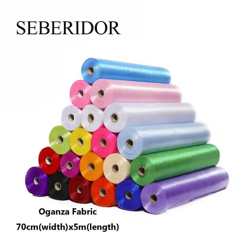 Seberidorブランドのオーガンザ生地ロールの鮮やかなセット（幅70cm）。青、ピンク、白、緑、紫、赤などの多様な色が含まれ、DIYの装飾プロジェクトに適しています。