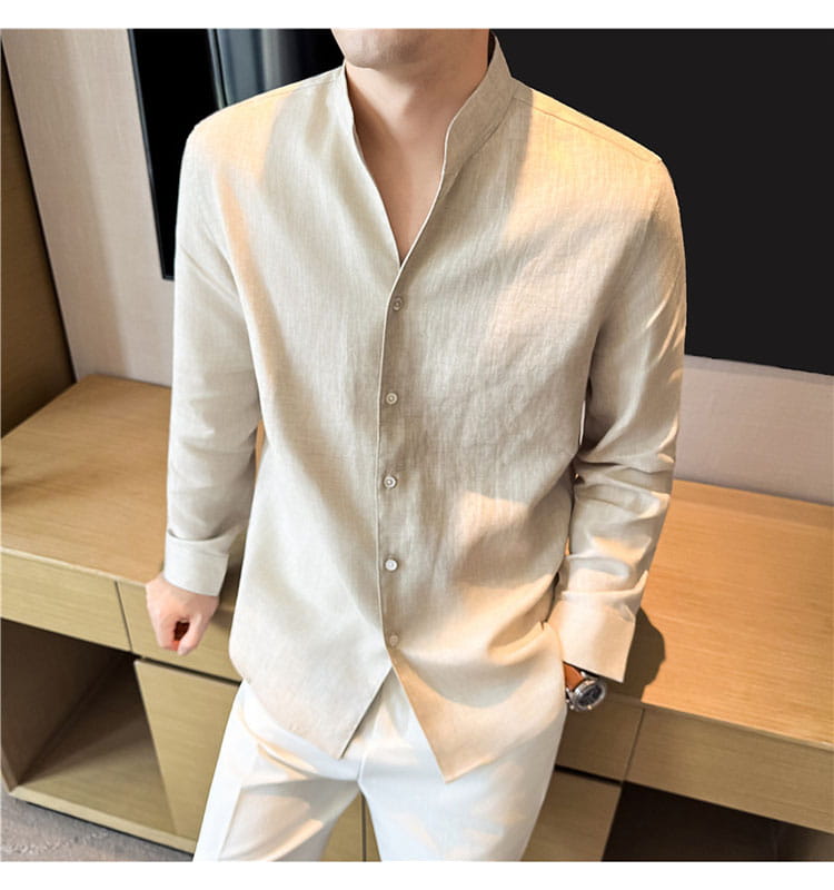 Beige linen men’s button-up shirt with a mandarin collar and long sleeves.