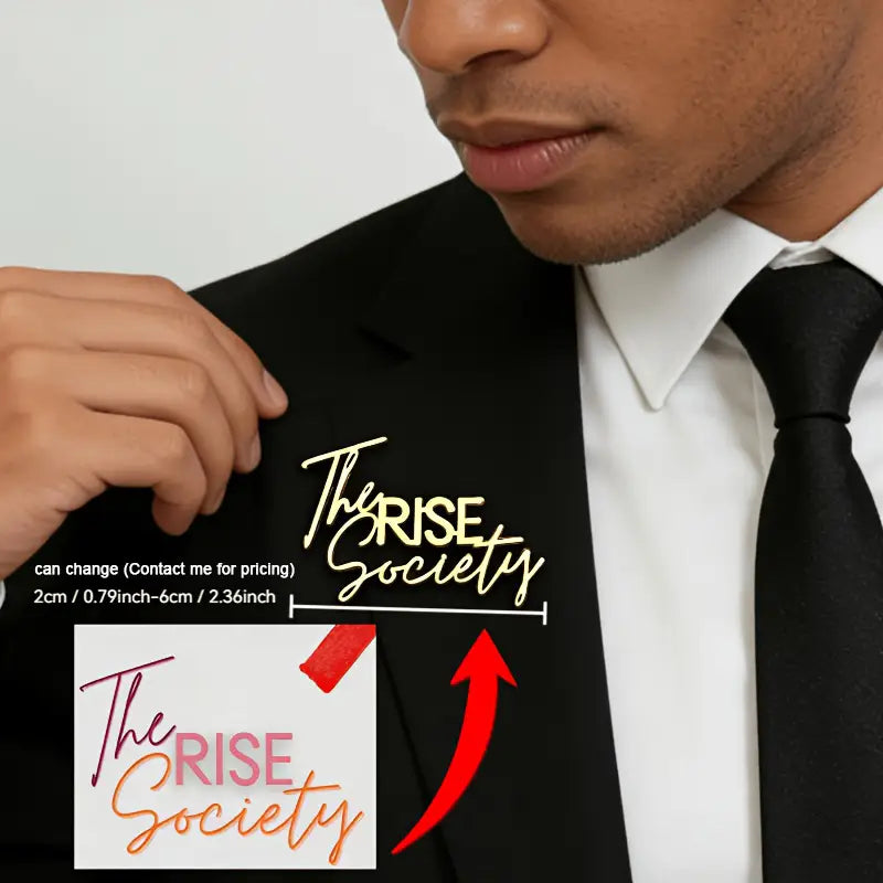 custom signature logo brooch personalized metal pin featuring gold metallic the rise society lettering decal on a black suit jacket.