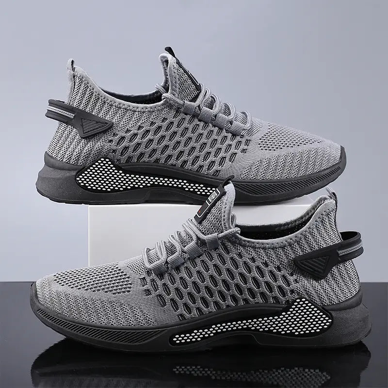 Men breathable slip-on mesh sneakers in gray knit with black accents and a breathable mesh upper.