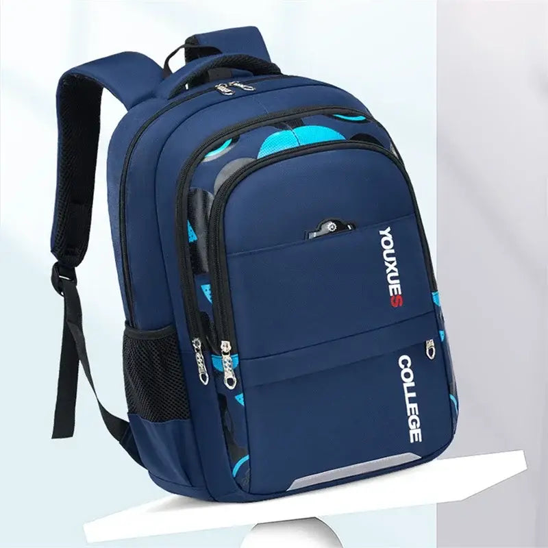Wasserdichter Schulrucksack für Jungen in Navyblau mit petrolfarbenen kreisförmigen Mustern und schwarzen Netztaschen seitlich von youxues.