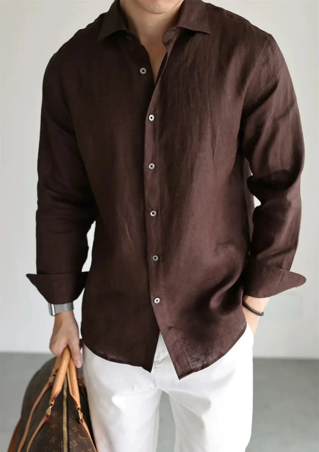 A dark brown long-sleeved linen button-down shirt with a classic collar and white buttons designed for men casual wear.