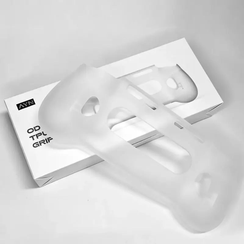 Translucent white silicone ayn odin 3 tpu grip protective shell and case with molded ergonomic contours and ventilation cutouts for enhanced bike handlebar comfort.