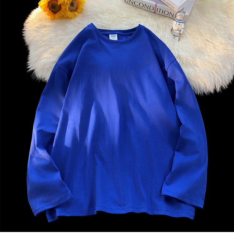 Oversized long sleeve blank t-shirt in vibrant royal blue with a soft slightly textured fabric and crew neck design.