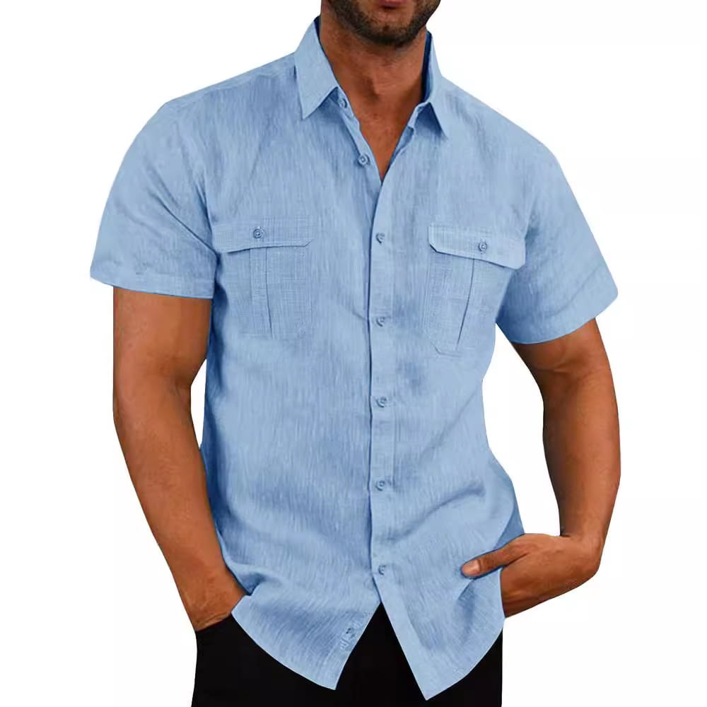 Men linen short sleeve shirt in light blue with double chest pockets and subtle textured fabric for casual summer wear.