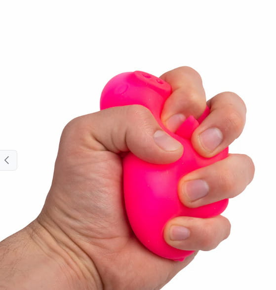 bright pink squishy stress ball shaped like a pig needoh digging pig sensory fidget toy designed for tactile stimulation and stress relief.