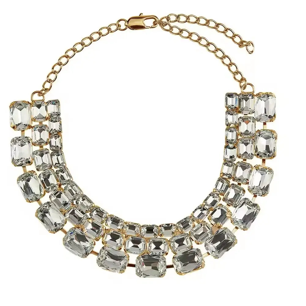 A gold-toned crystal statement choker necklace for women featuring multiple rows of clear faceted rectangular crystals.