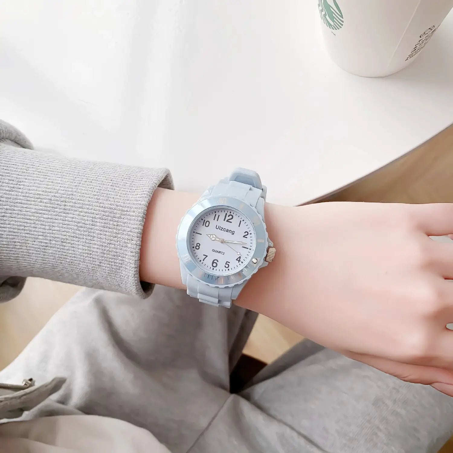 Light blue kids silicone quartz watch with a white dial and black numerals in a colorful jelly wristwatch design.