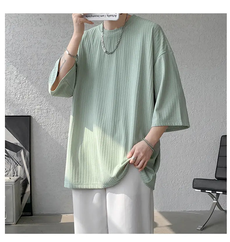 Light green ribbed cotton men striped oversized summer t-shirt with three-quarter sleeves and a relaxed fit.