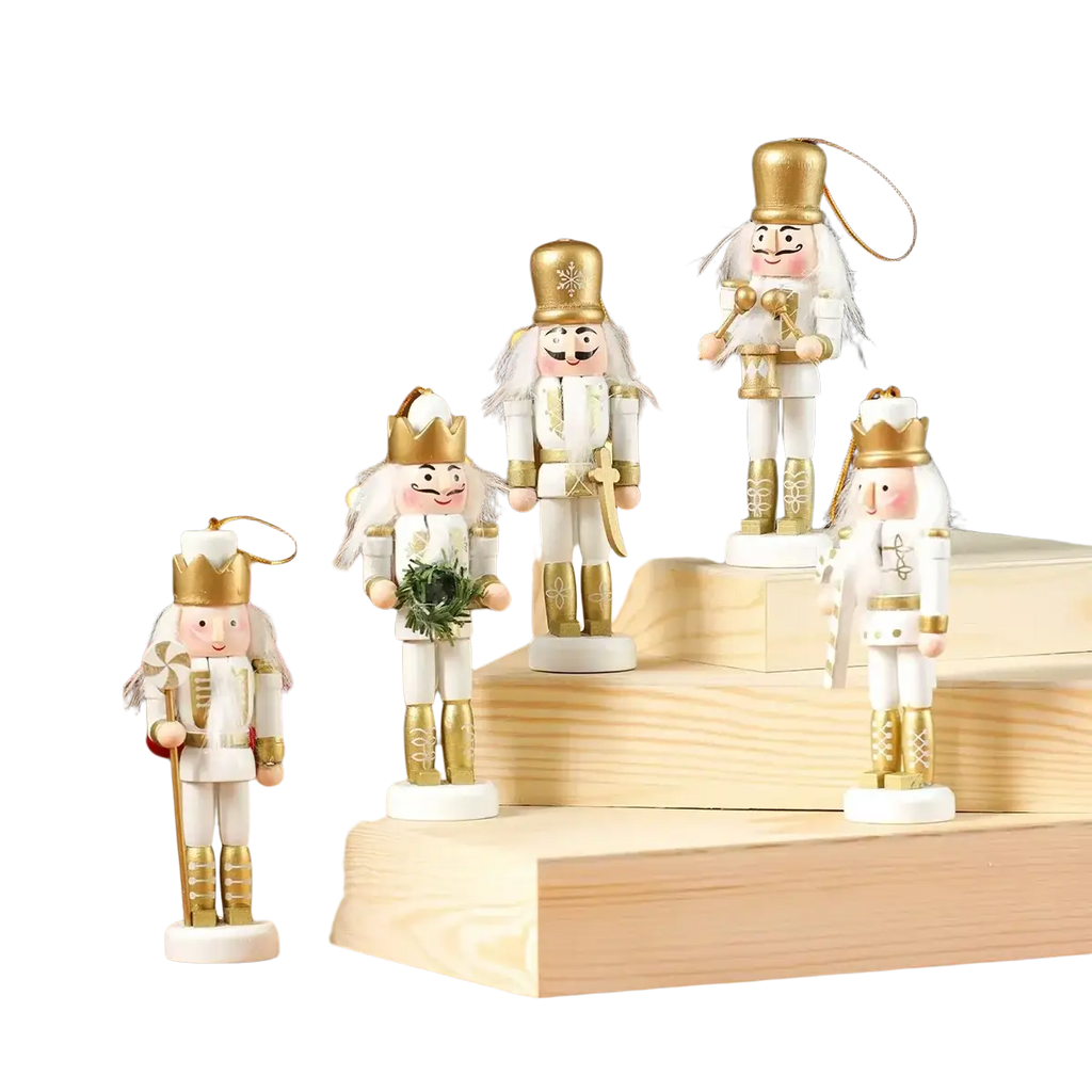 White and gold wooden nutcracker figurines with detailed crowns and uniforms ideal for christmas tree decorations