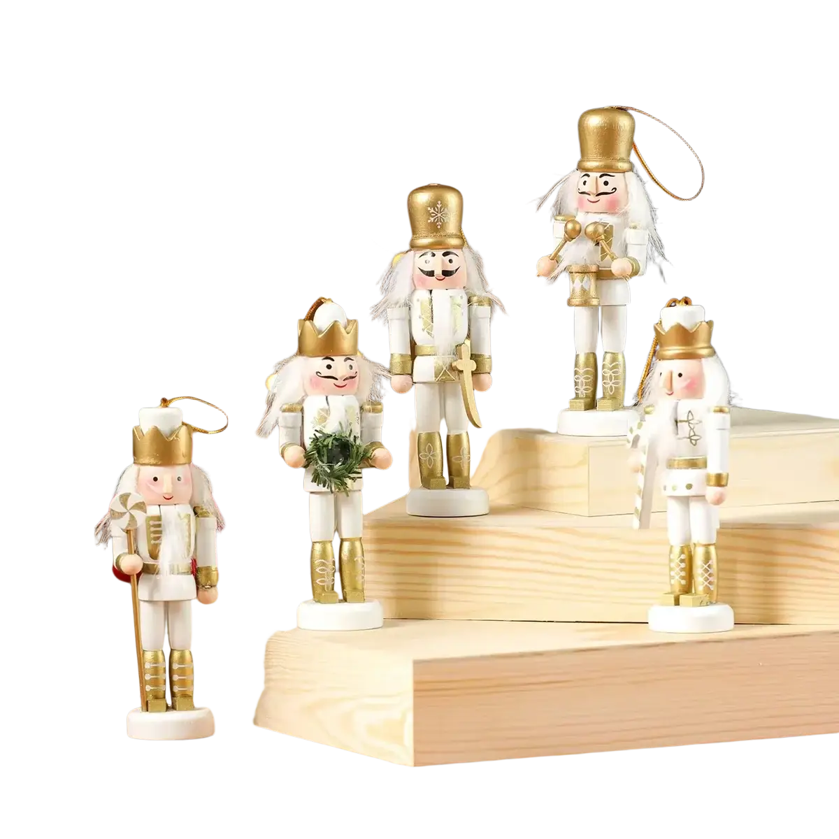 White and gold wooden nutcracker figurines with detailed crowns and uniforms ideal for christmas tree decorations