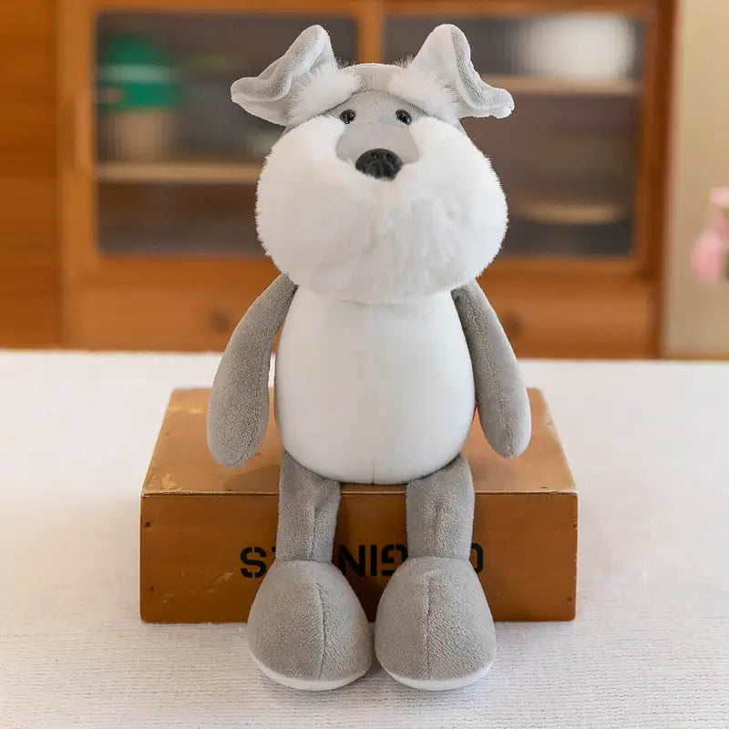 Jouet chien schnauzer en peluche rembourré blanc et gris, avec une fourrure douce et duveteuse et des yeux à boutons noirs, inclus dans la collection de jouets lion éléphant tigre de la forêt