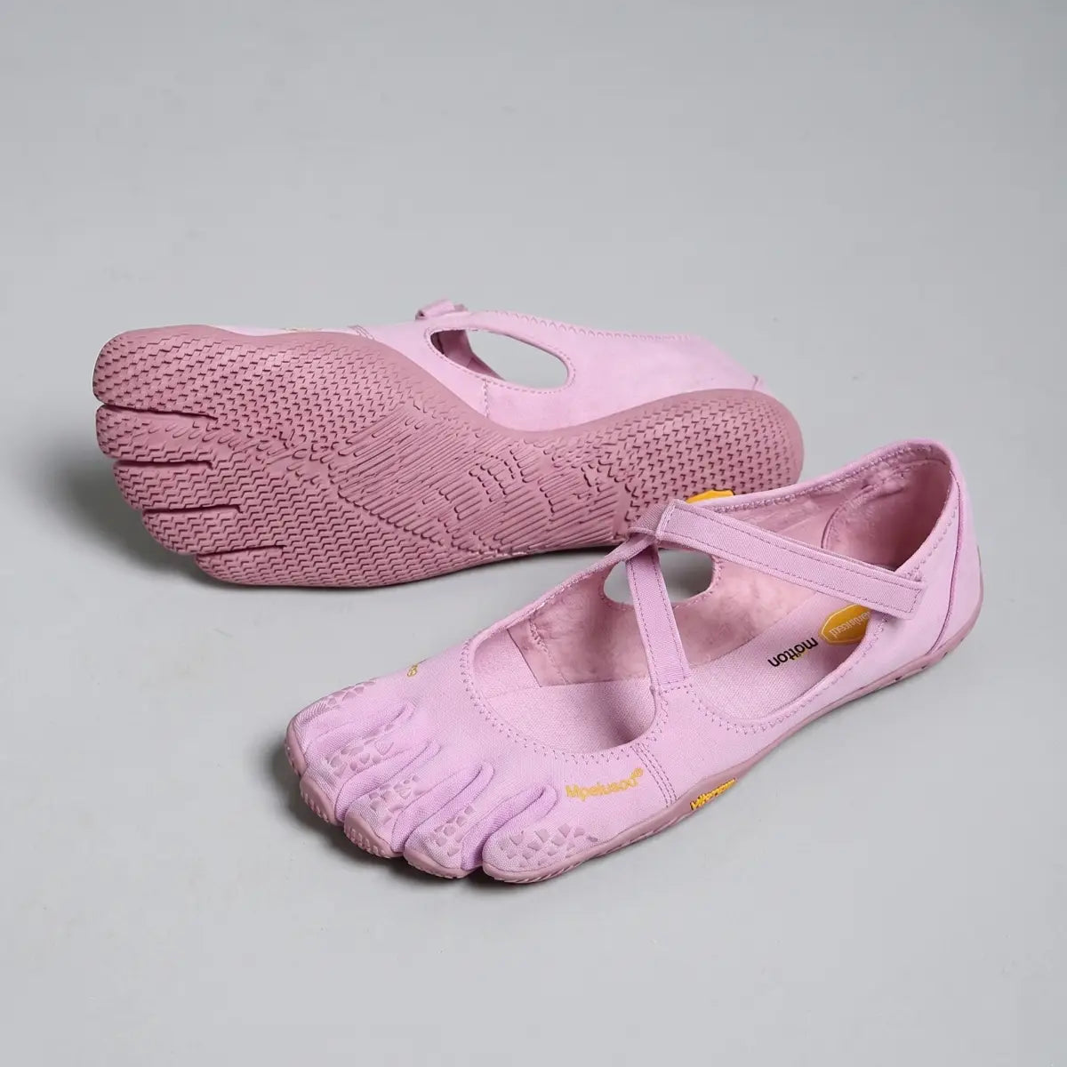 Pink vibram fivefingers women five toe minimalist barefoot shoes with toe-separated design and breathable upper.