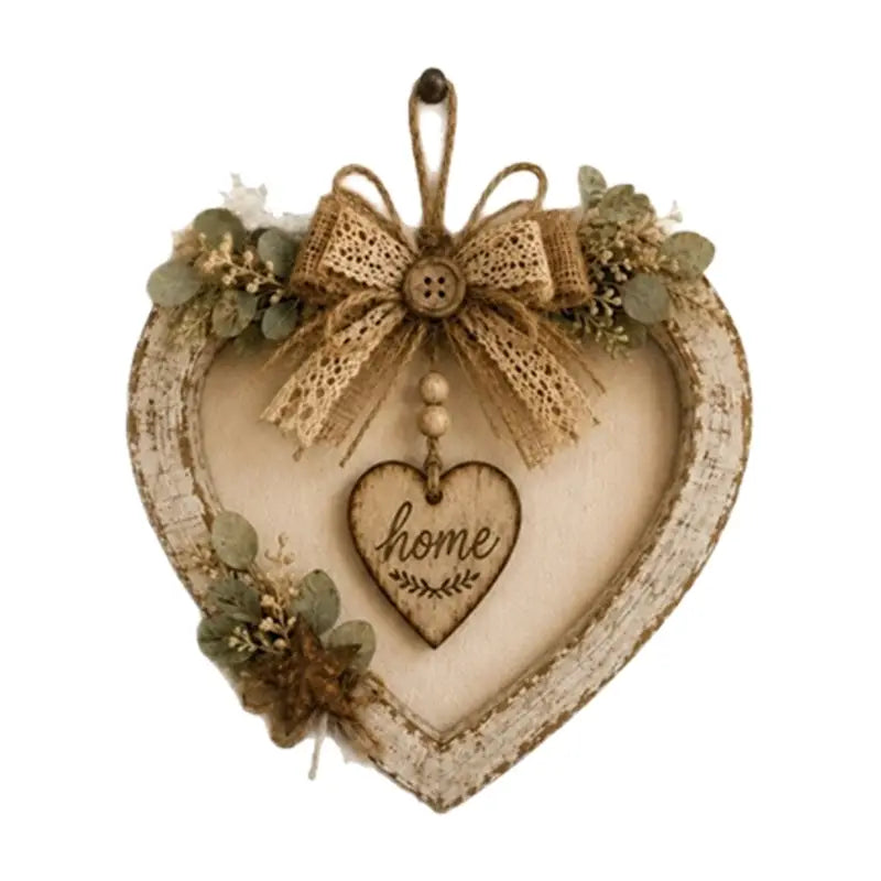 Plaque murale en bois rustique en forme de cœur, finition blanche vieillie, nœud en toile de jute et verdure séchée pour la décoration intérieure.