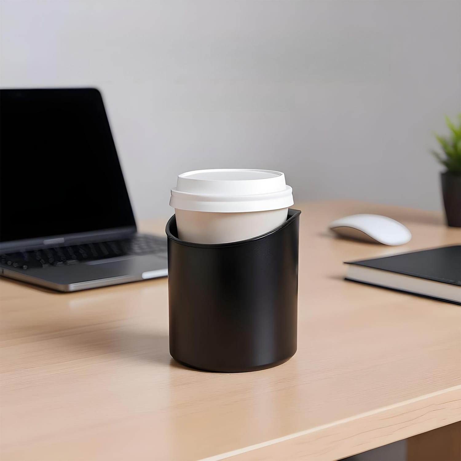 Black cylindrical car door cup holder made of durable material holding a white disposable coffee cup with matching lid for vehicles.