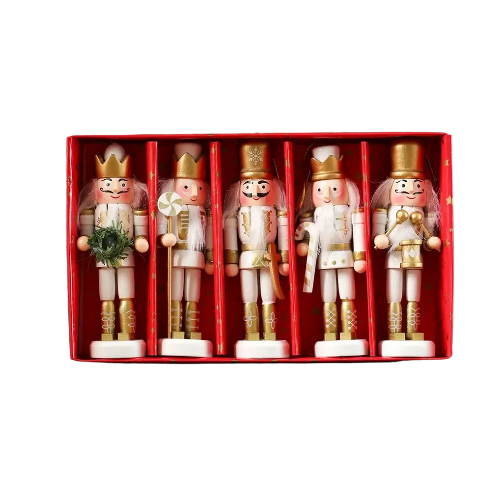 Five wooden nutcracker dolls in white and gold uniforms with festive accessories in a red box for christmas tree decor
