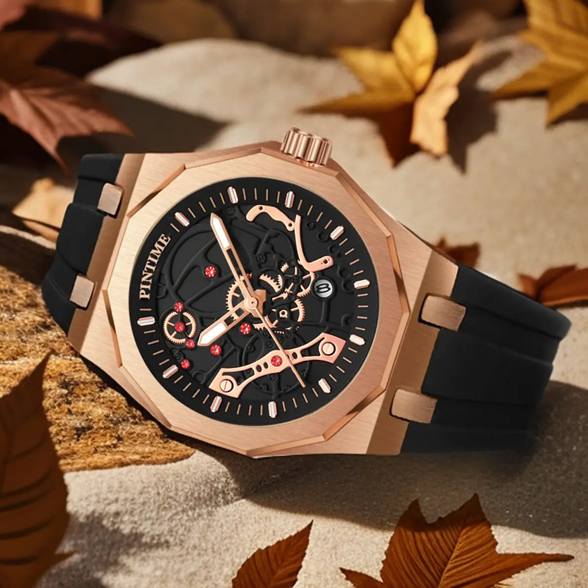 Pintime men luxury skeleton quartz watch with rose gold case, black dial, red gem accents, and black rubber strap.