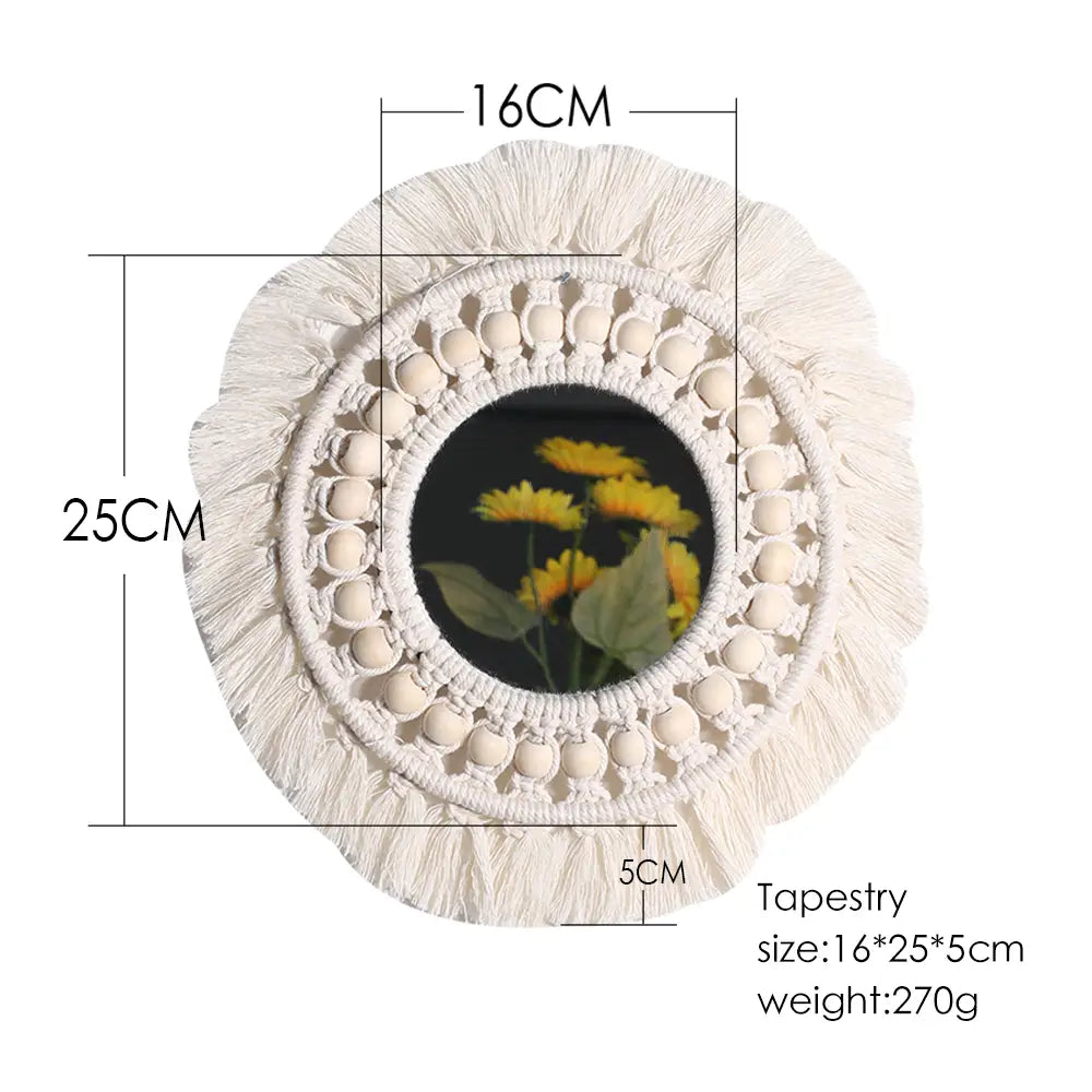 A cream-colored round macrame wall mirror with woven beads and tassels measuring 25cm in diameter, designed as a boho decorative wall mirror.