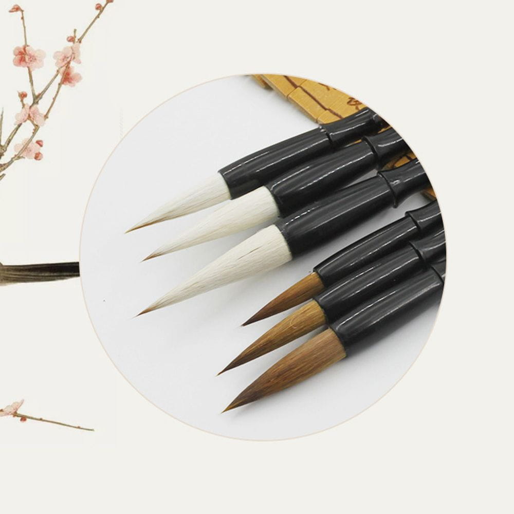 Set of five traditional Chinese calligraphy brushes with black handles and varying tip colors including white, light brown, and natural wood for writing practice from the Chinese calligraphy brush set 6 piece.