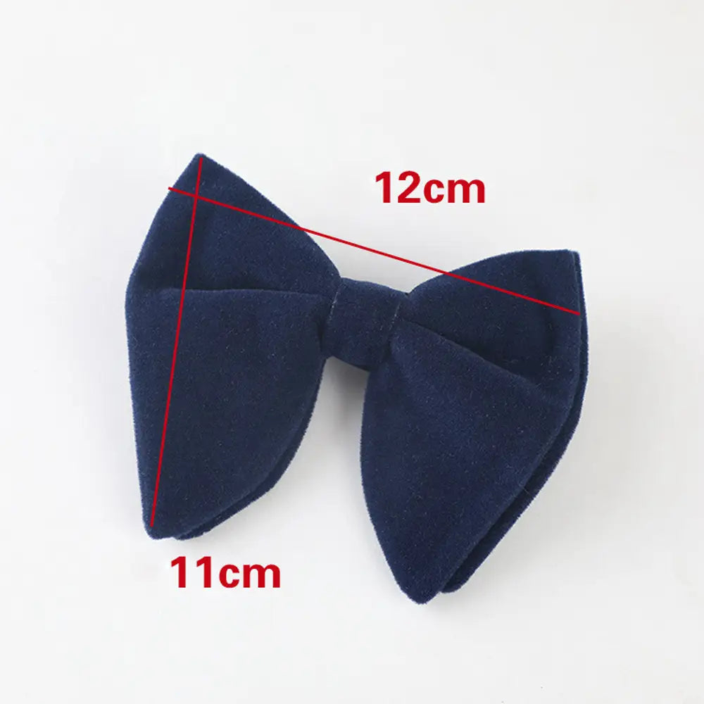 A navy blue velvet bow tie with a classic symmetrical design suitable for formal neckwear gift.