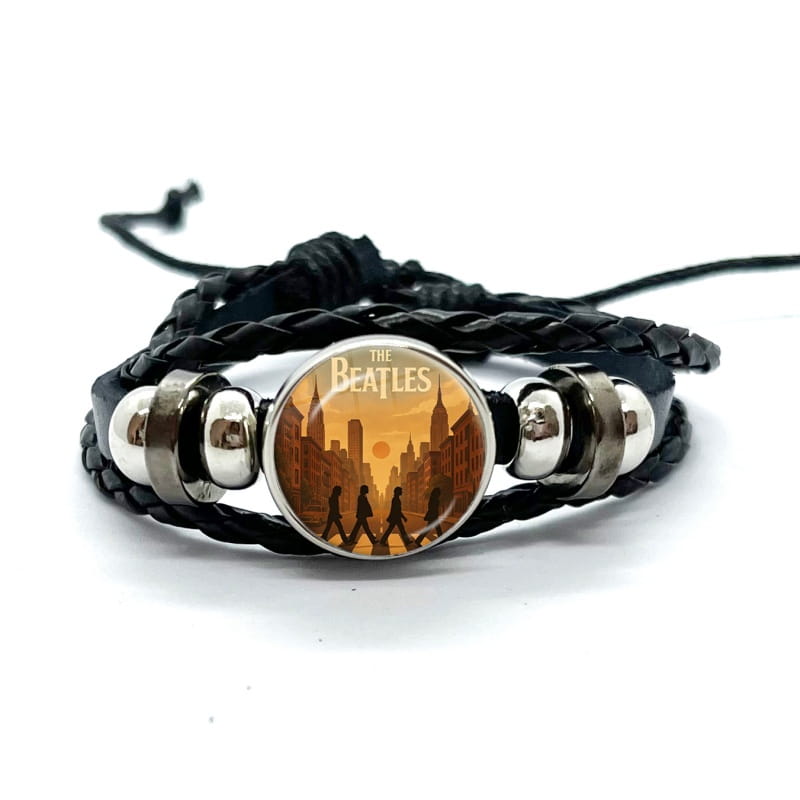 Black braided leather bracelet featuring a circular glass dome charm with the Beatles abbey road album cover design.