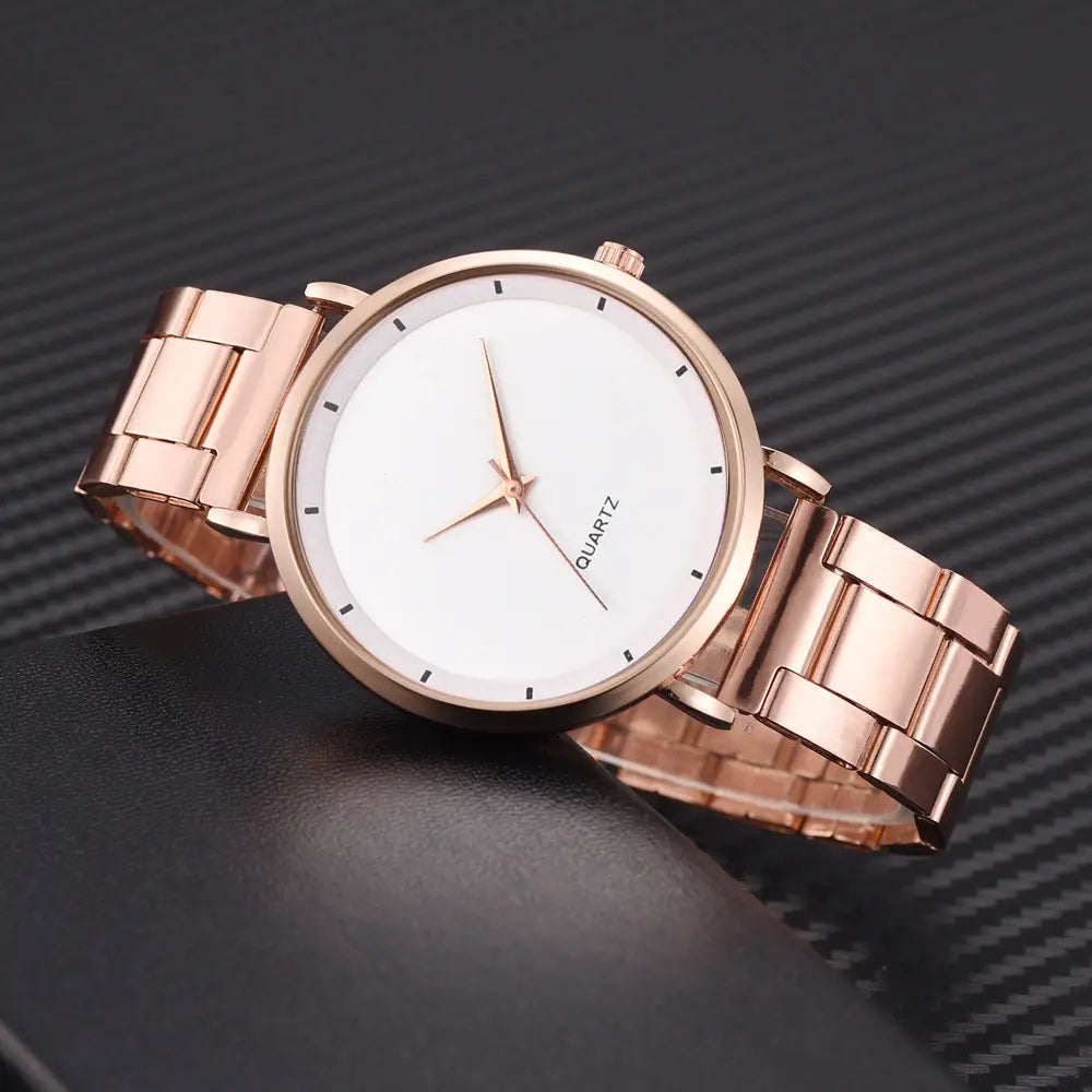 Rose gold women luxury quartz wristwatch with a sleek minimalist design featuring a white dial and matching rose gold-tone link bracelet suitable for business use.