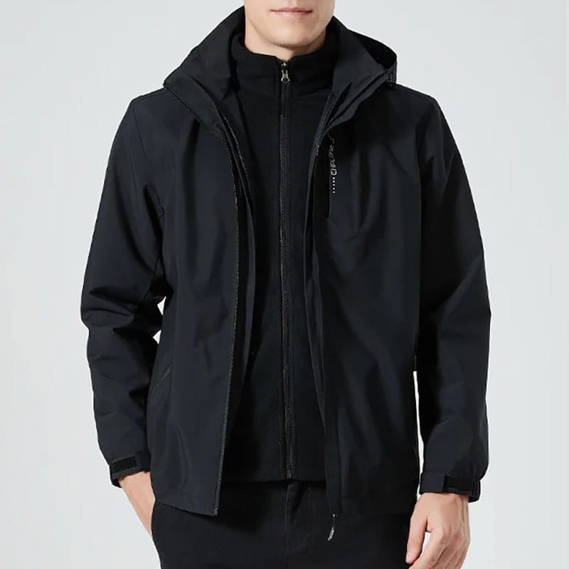 Men waterproof hiking jacket hooded windbreaker in black with a sleek modern design and subtle zipper detailing made from waterproof material.