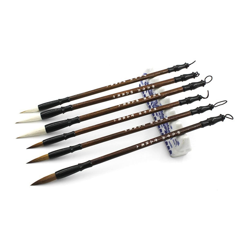 Set of six traditional Chinese calligraphy brushes with dark brown wooden handles black ferrules and natural bristles for writing practice.