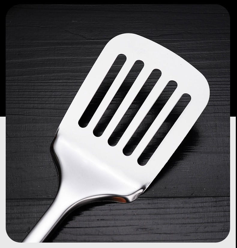 Shiny stainless steel slotted spatula with sleek modern design as part of stainless steel kitchen utensil set 9-piece cooking tools.