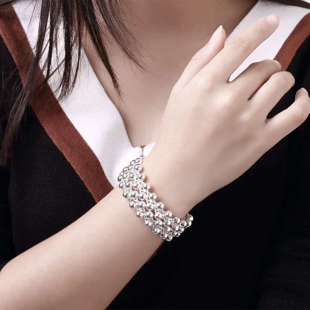 925 silver grape bead jewelry set featuring a silver beaded bracelet with a layered intricate design.