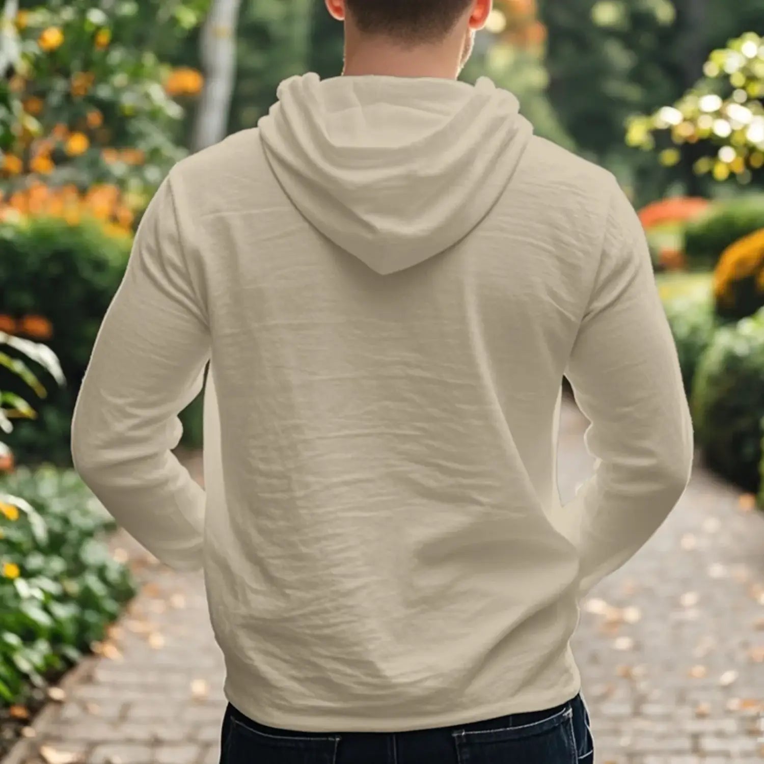 Cream-colored men cotton linen hooded henley shirt with long sleeves soft fabric texture and relaxed fit.