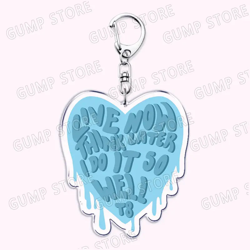 A light blue heart-shaped acrylic keychain with a silver metal clasp featuring the phrase live now think later do it so well in bold dripping font from Tate Mcrae acrylic keychain music fan gift.