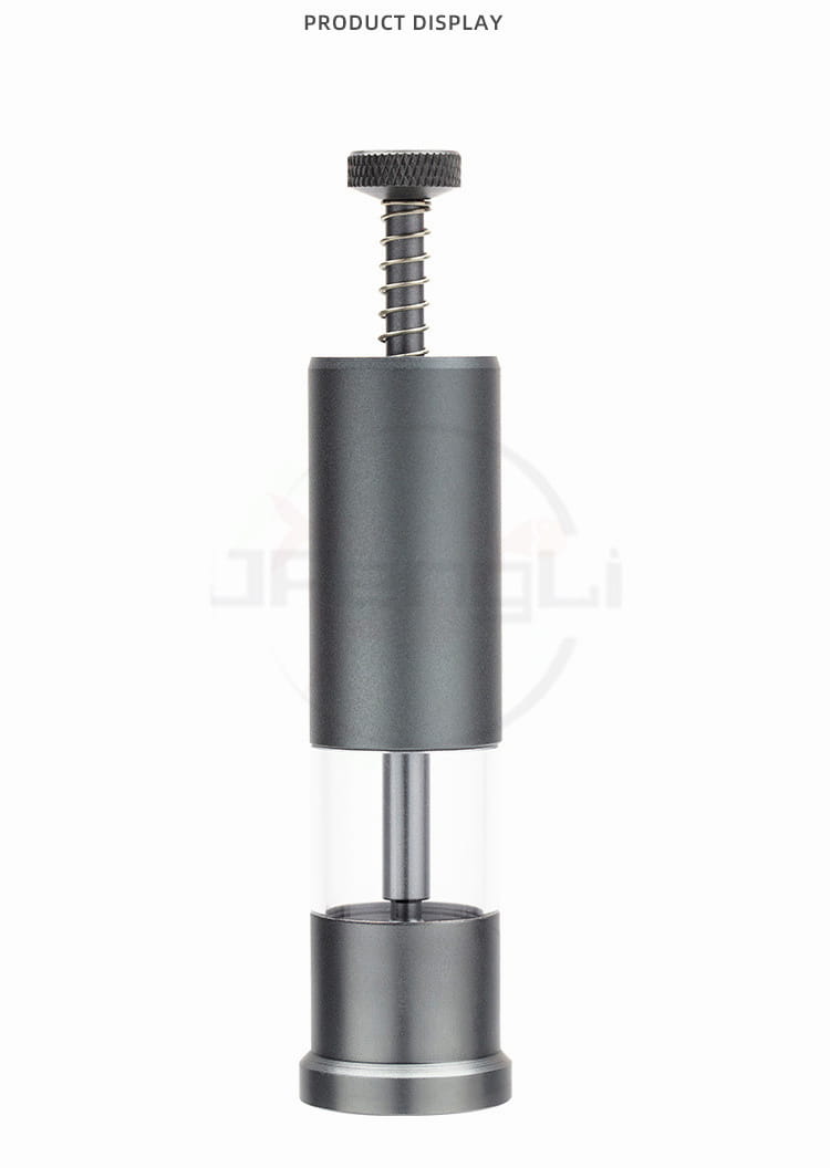Gray metallic feeder mini aquarium accessory with a cylindrical shape, threaded screw top, and clear central section for small fish food dispensing.