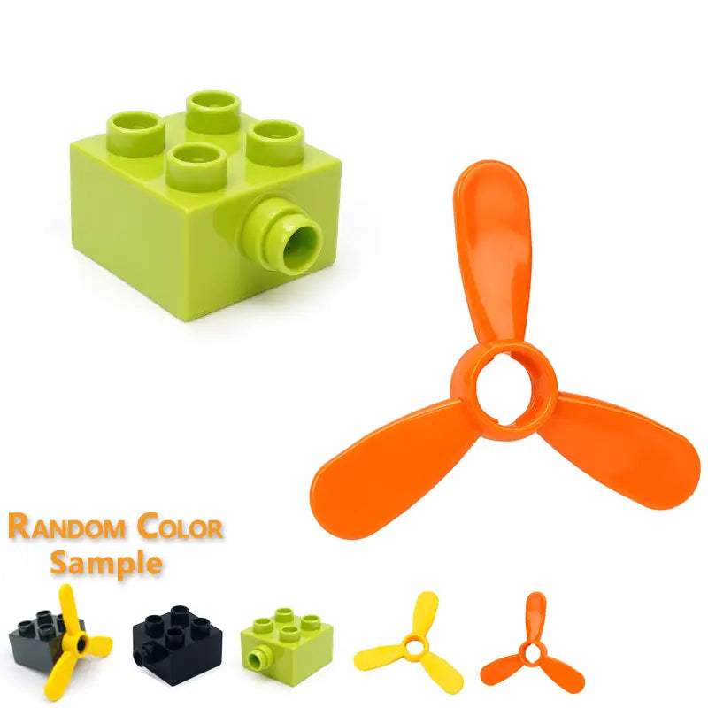 Bright orange three-bladed propeller toy piece compatible with Duplo building blocks for train car toys.