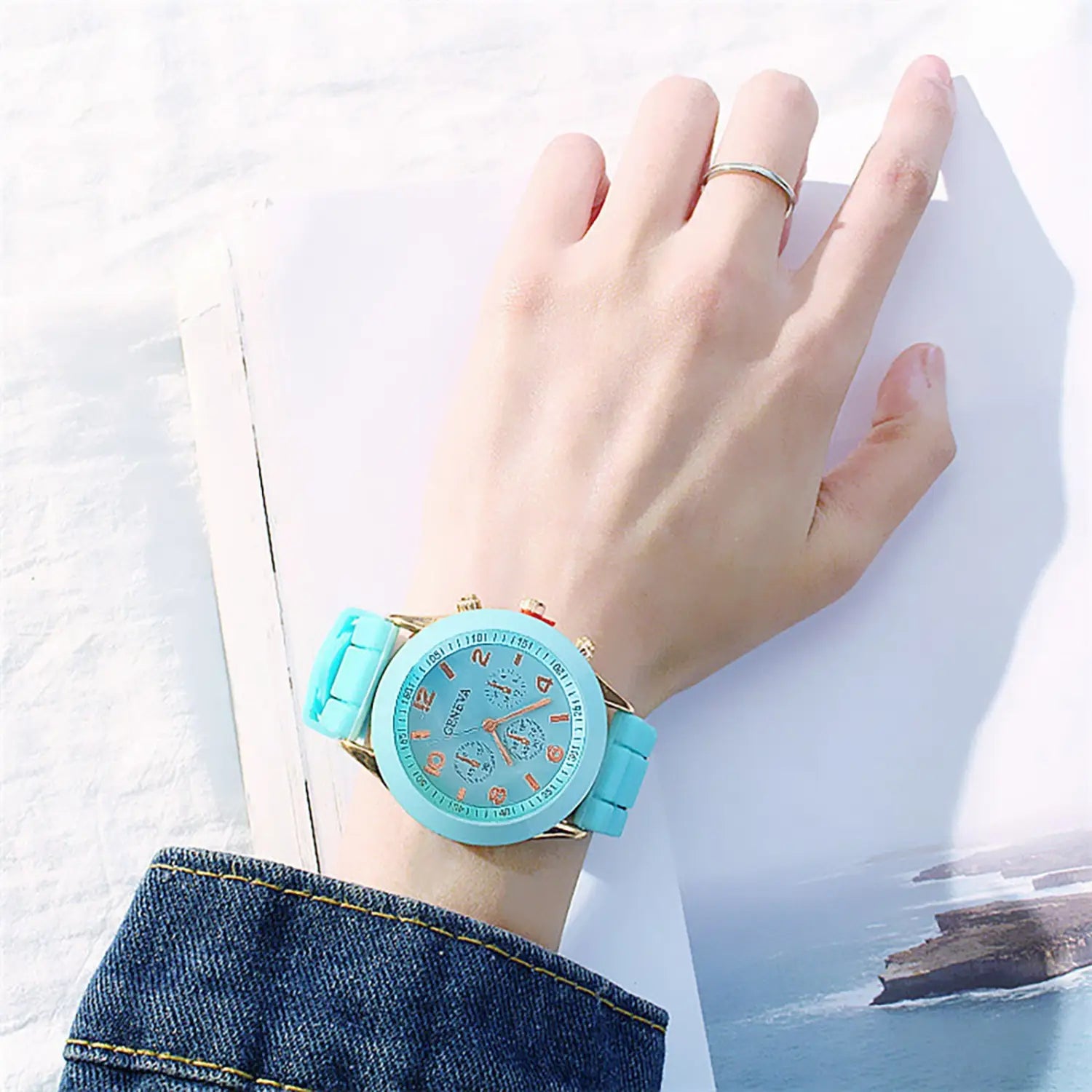 A women silicone quartz chronograph watch with a turquoise silicone strap, gold-tone case, three sub-dials, and the brand name Cerea on the face.