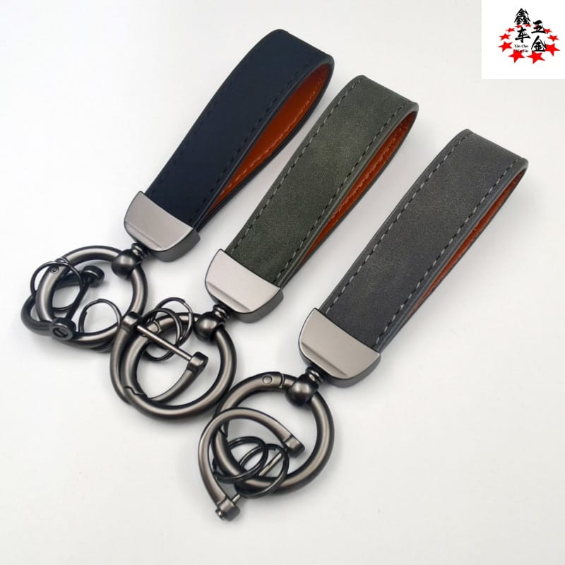 genuine leather keychain 5-pack featuring three leather keychains with dark metal rings and contrasting orange inner lining for car key use