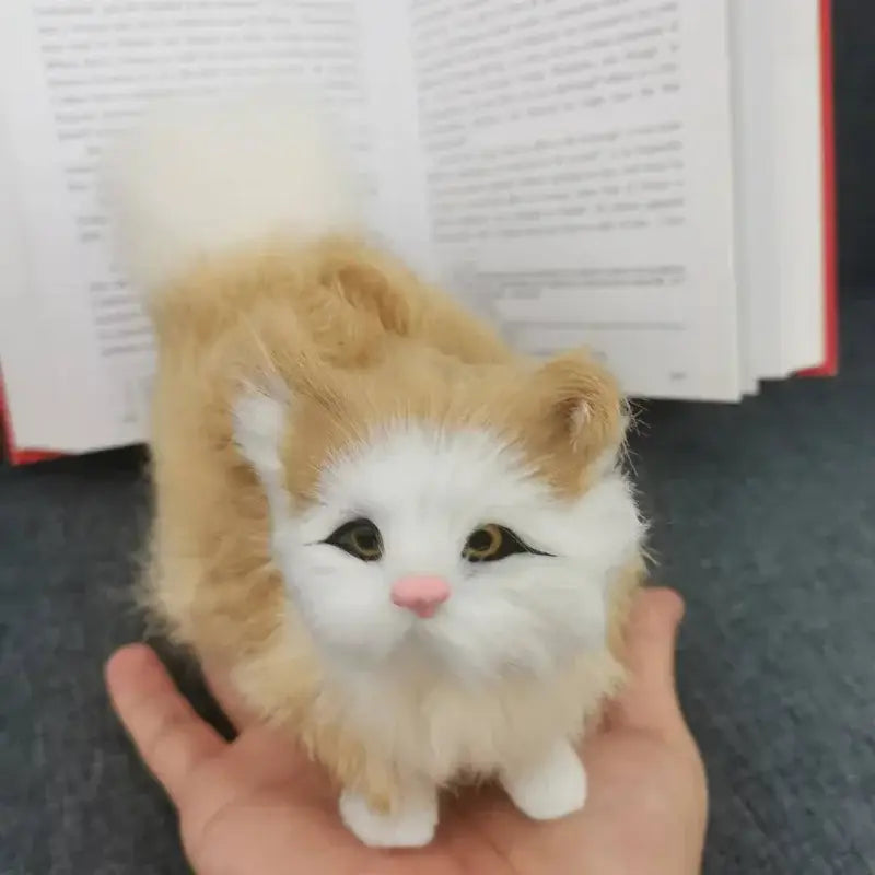 simulation cat plush soft stuffed animal toy featuring a plush, fluffy ginger and white cat figurine with soft fur, embroidered eyes, a pink nose, and tiny paws.